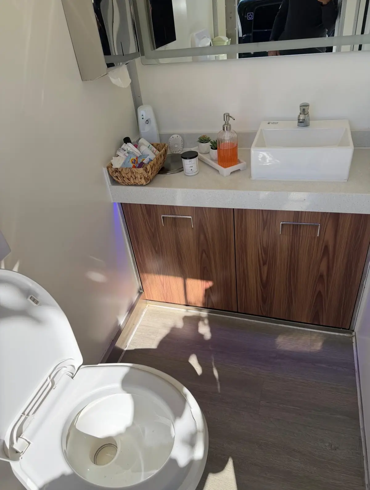 Restroom trailer sink with amenities